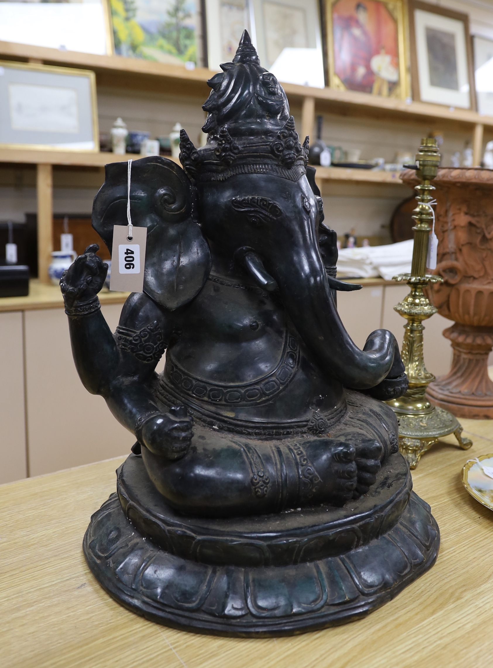An Indian green patinated bronze model of Ganesha, on lotus base, 59cm